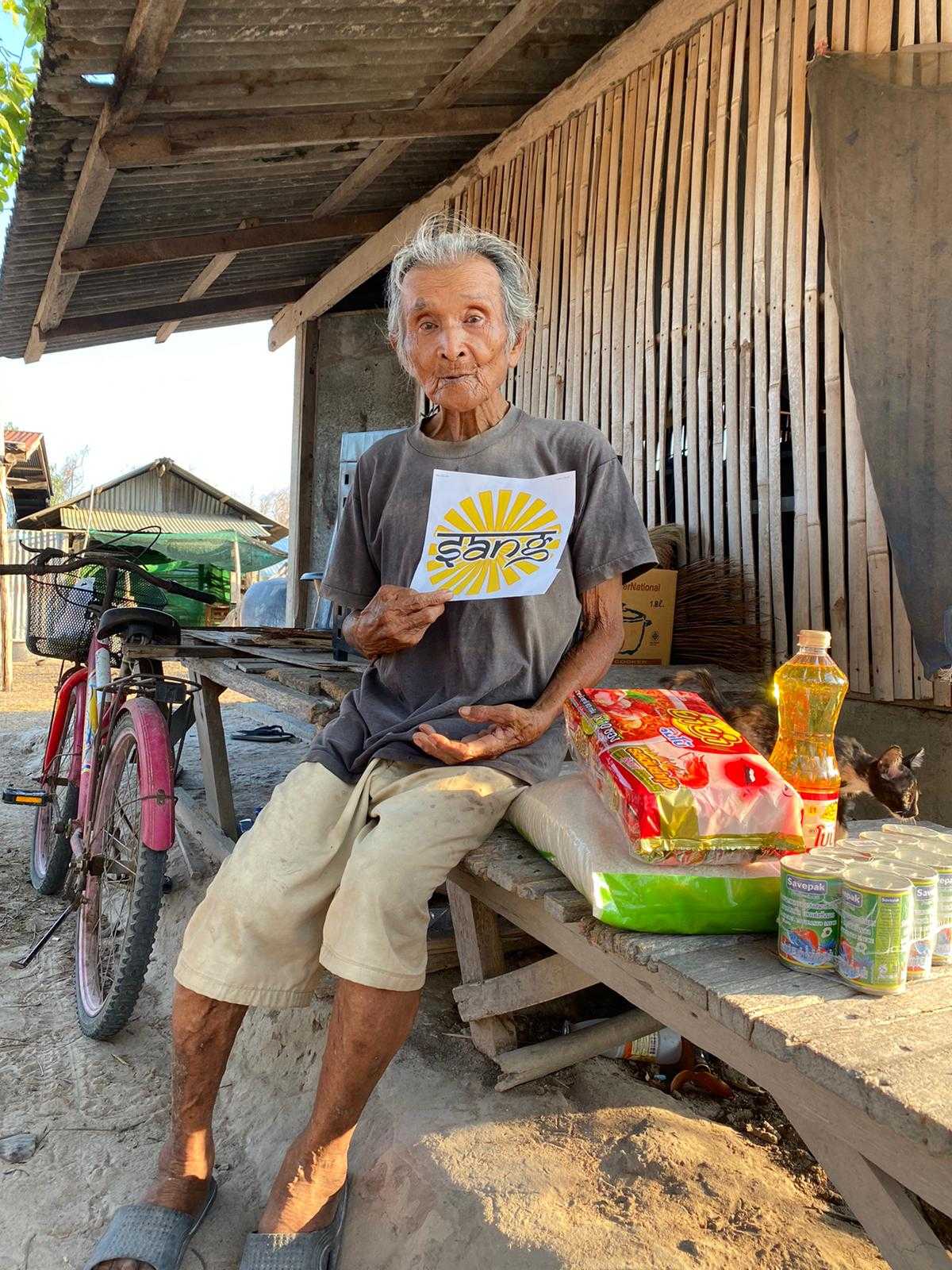 elderly person with food package